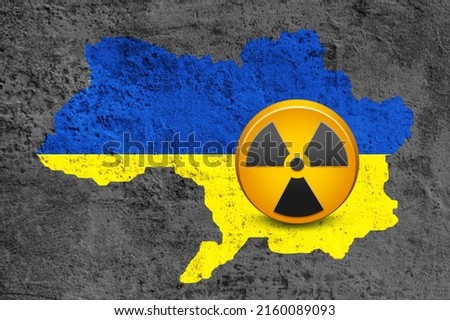 Concept of the atomic energy Policy of world concept. A flag Ukraine and a radiation hazard sign