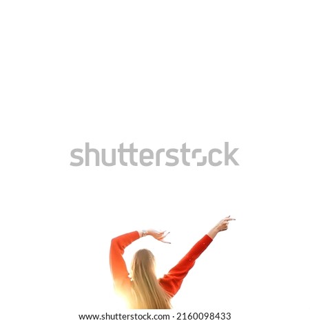 ong-haired blonde girl, dressed in red, dancing in the sunlight