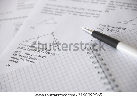 Handwriting of geometrical tasks on examination, practice, quiz or test in geometry class. Solving exponential equations background concept. Royalty-Free Stock Photo #2160099565