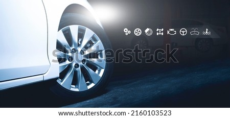 The white car open a headlight parked on the cement road at night time and auto service business icon,Double exposure,Auto repair shop business concept Royalty-Free Stock Photo #2160103523