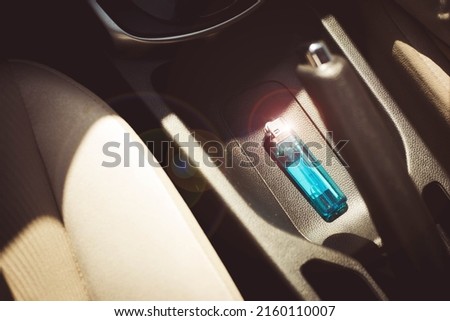 A lighter placed in a car on a sunny day can explode and catch fire. Leaving a lighter in your car can be dangerous. Advice on cars and things that shouldn't be overlooked Royalty-Free Stock Photo #2160110007