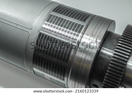 Used magnetic cylinder with attached flexible die for die cutting on rotary printing press. Die-cutting of labels. Cut knife for paper labels. Rotary stamp. Offset cutting knife for printing machine Royalty-Free Stock Photo #2160123339