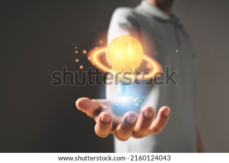 hand with light bulb. idea concept with innovation and inspiration