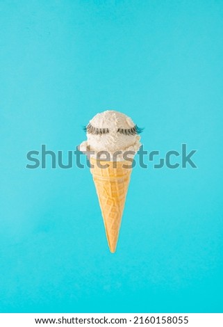 Creative arrangement made of ice cream in a cone with lashes. Minimal summer concept.