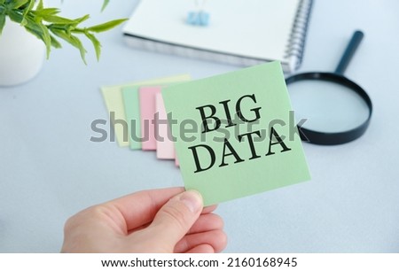 Big Data text with hands and colorful sticker. Business concept