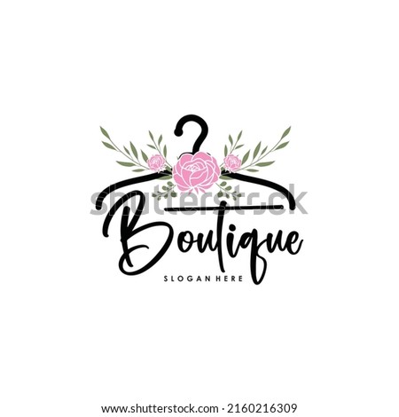 The concept of a coat hanger logo with roses for the clothing collection boutique logo template. Royalty-Free Stock Photo #2160216309