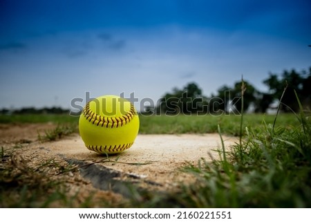 softball on Homepage and View of a Softball Field from Home Plate