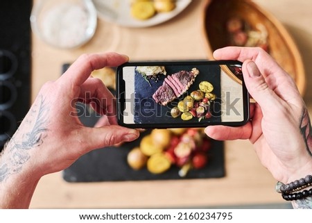 Taking Picture Of Steak With Side Dish