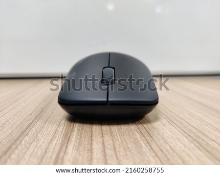 A mouse lying on table