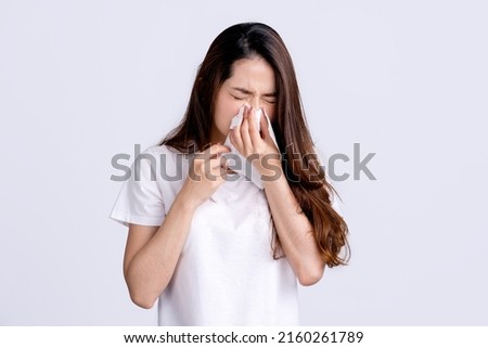 Young beautiful asian woman got sick and flu on white background. Royalty-Free Stock Photo #2160261789