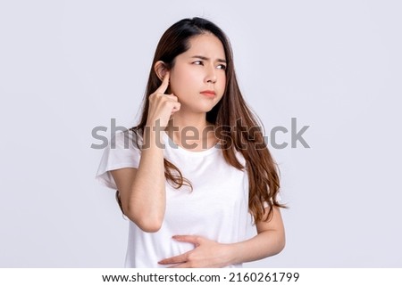 Asian woman has pain in the ear, Tinnitus concept. Isolated on white background. Royalty-Free Stock Photo #2160261799
