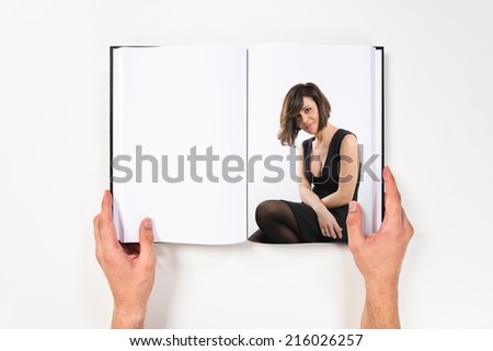 Pretty woman with black dress printed on book