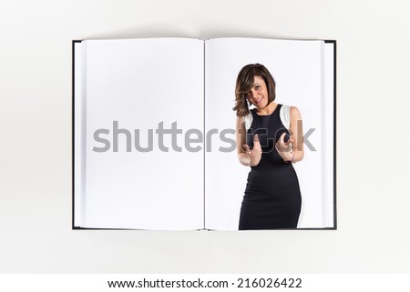 woman in black clothes surprised printed on book