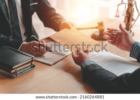 Concepts of corruption, bankruptcy courts, bail, crime, bribery, fraud, Judge Gavel, soundboard, and a handful of cash on the table. Royalty-Free Stock Photo #2160264881