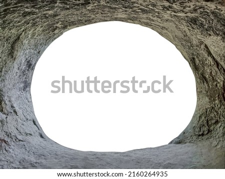 View from inside of cave or stone grotto hole in rocky mountains Royalty-Free Stock Photo #2160264935