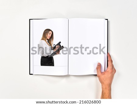 Cute girl writing printed on book