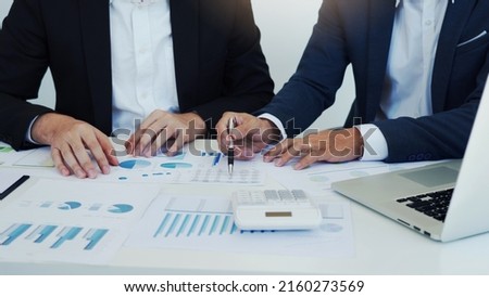Group of business people analysis summary graph reports of business operating expenses and work data about the company's financial statements. Royalty-Free Stock Photo #2160273569
