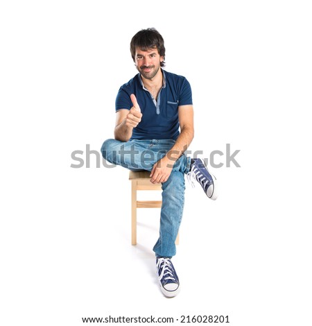 Man with thumb up over white background