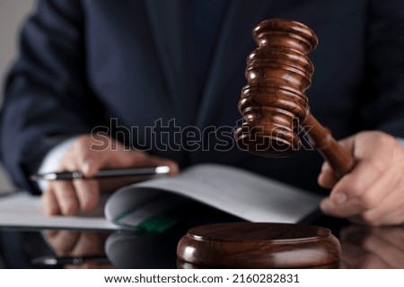 The lawyer reviews the contract.