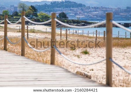 wooden walkway with beach in the background. holiday landscape