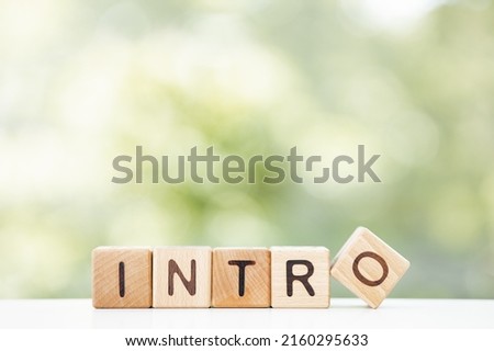 Intro on wood block. Intro green summer background for your design Royalty-Free Stock Photo #2160295633