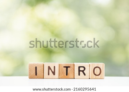 Intro on wood block. Intro green summer background for your design Royalty-Free Stock Photo #2160295641