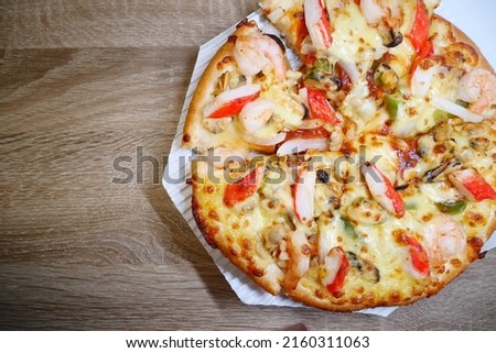 Pizza in front of seafood, a popular quick menu, call to order and eat.
