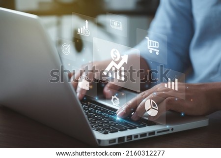 Inflation Concept.Man using a laptop with an Increasing diagram of the inflation rate on a virtual screen laptop.financial graph showing statistics, stock market crash, crisis, inflation rate.