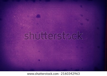 Blank grained toned film strip texture background with heavy grain, dust and light leak