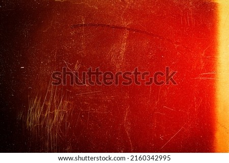 Blank grained toned film strip texture background with heavy grain, dust and light leak Royalty-Free Stock Photo #2160342995
