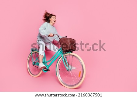 Full length profile side photo of young pretty woman good mood look empty space isolated over pink color background