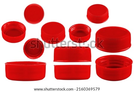 Red caps for bottles, different sizes. Set of red caps isolated on a white background. Royalty-Free Stock Photo #2160369579