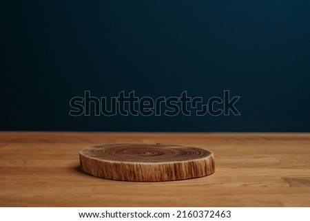 Wooden shelf and stand on dark background