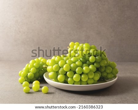 green grapes on a plate	 Royalty-Free Stock Photo #2160386323