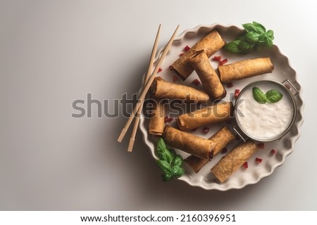 Delicius Springrolls Neatly Aranged with White Background Royalty-Free Stock Photo #2160396951