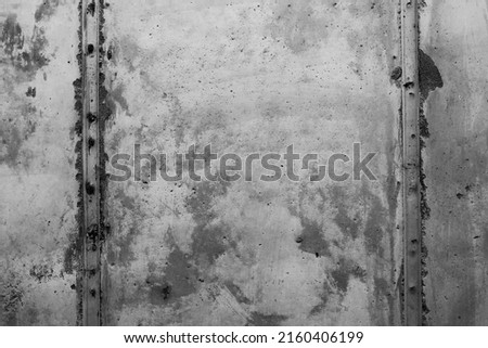 Closeup of a raw industrial concrete wall black and white.