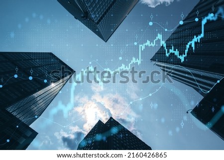 Real estate and investment concept with bottom view on sunny skyscrapers tops and digital financial chart with stock market diagram Royalty-Free Stock Photo #2160426865