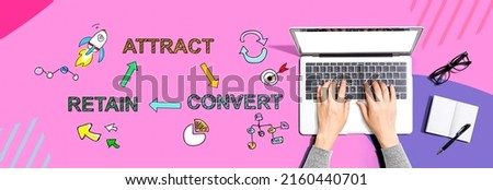 Attract convert retain concept with person using a laptop computer