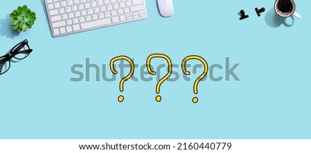 Question marks with a computer keyboard and a mouse