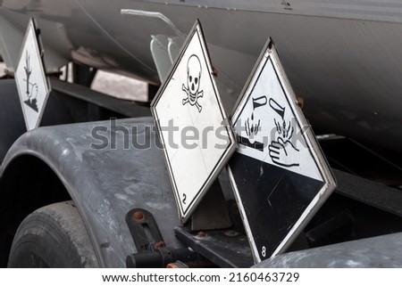 Dangerous, Poisonous and Corrosive liquids Signs on Special Trucks for transportation of this kind of materials