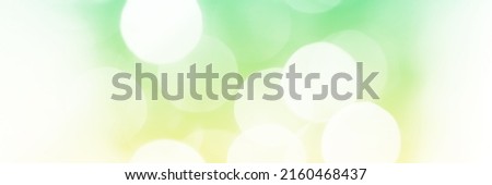 Summer green sparkling glitter bokeh background, banner texture. Abstract defocused lights header. Wide screen wallpaper. Panoramic web banner with copy space for design