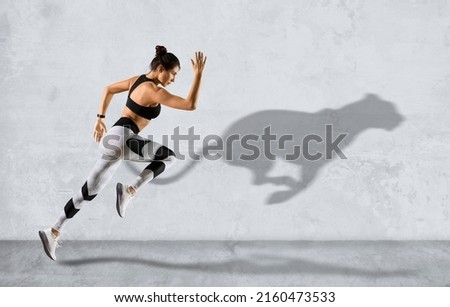 Sporty woman running on grey wall background wearing in sportswear. Sport and fitness motivation banner