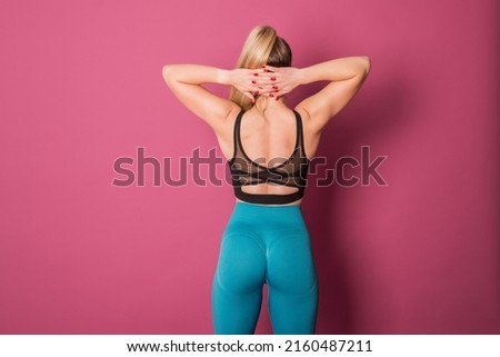young girl doing sports, sports girl on a pink background, stretching, yoga. High quality photo