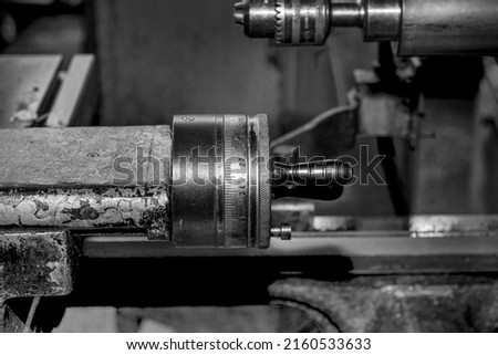 Metalworking workshop, metal processing machines.  Vintage Industrial Machinery in a old factory - black and white photo