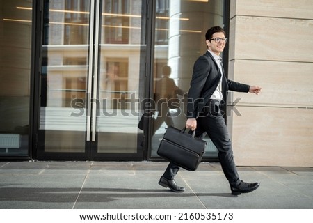 A financier a banker a man in glasses and a strict suit a businessman goes to work in the office