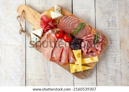 Appetizers table with different antipasti, charcuterie, snacks and cheese. Buffet party. Top view, flat lay, copy space, negative space Royalty-Free Stock Photo #2160539307