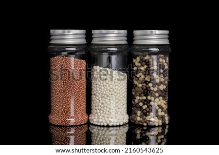 Colorful of candy sprinkles in glass bottle 
