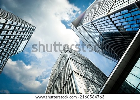 Looking up at modern business buildings