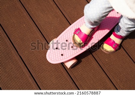A child is riding a skateboard.