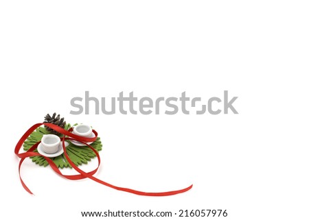 Picture with red ribbon, two miniature cups and decorations